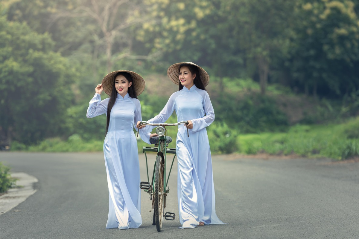 Vietnamese women wearing colorful Ao Dai dresses during a cultural festival